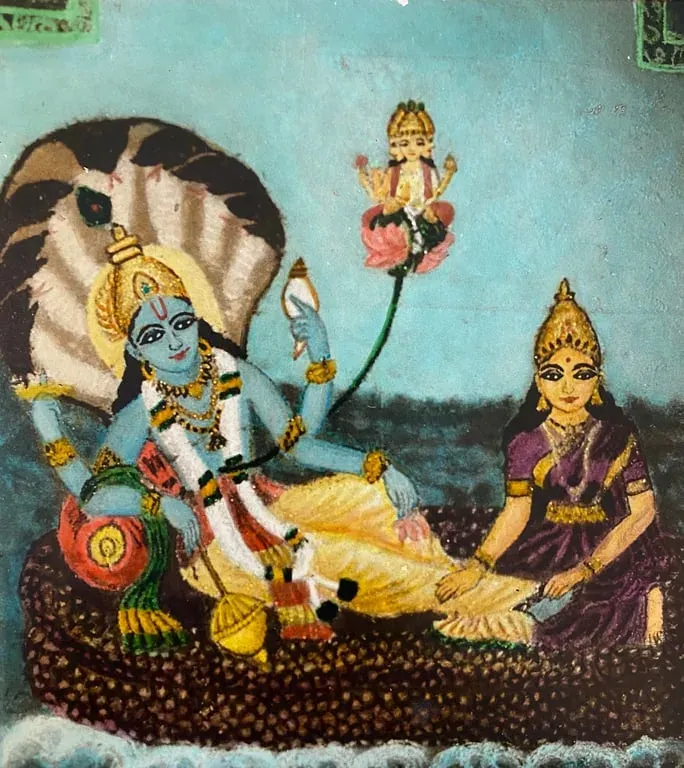 Coloured rangoli of Vishnu reclining on the serpent with Lakshmi at his feet